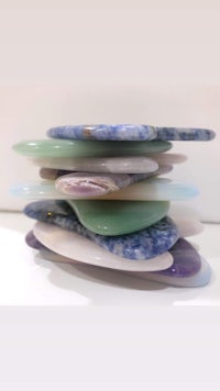 a stack of different colored stones stacked on top of each other